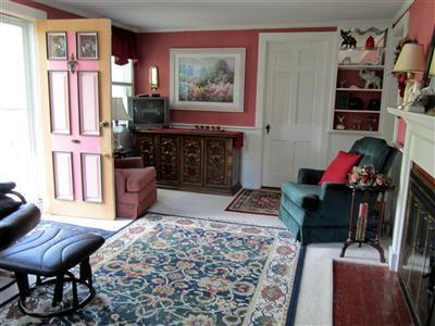 79 Earle Road West Harwich, MA 02671 - Photo 5 of 30 a living room with furniture a rug and a closet