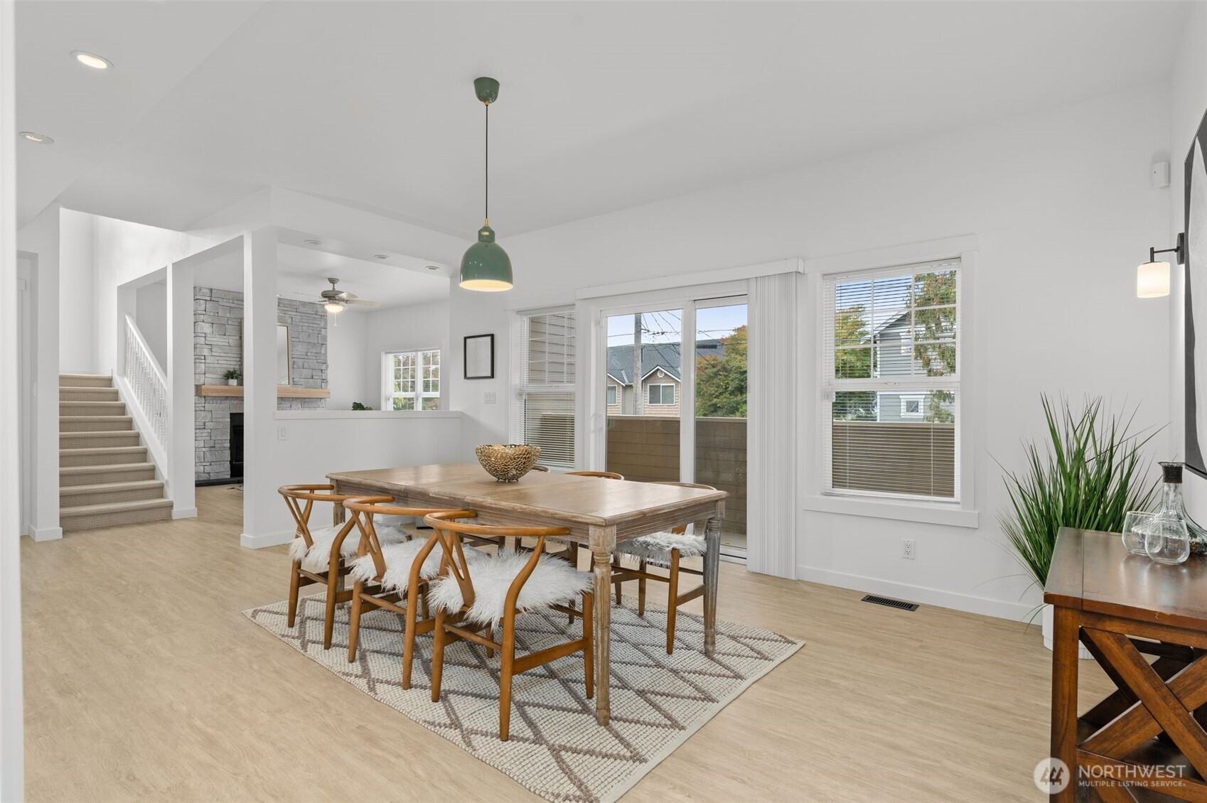6507 41st Avenue Southwest Seattle, WA 98136 - Photo 13 of 37 a view of a dining room with furniture window and wooden floor