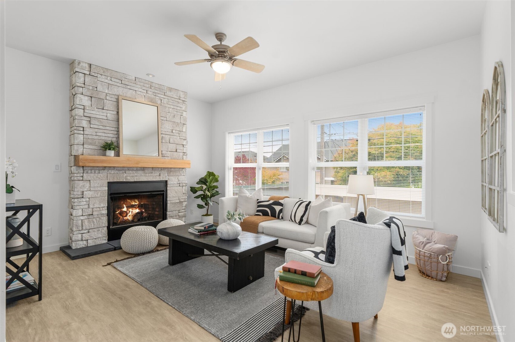 6507 41st Avenue Southwest Seattle, WA 98136 - Photo 15 of 37 a living room with furniture and a fireplace
