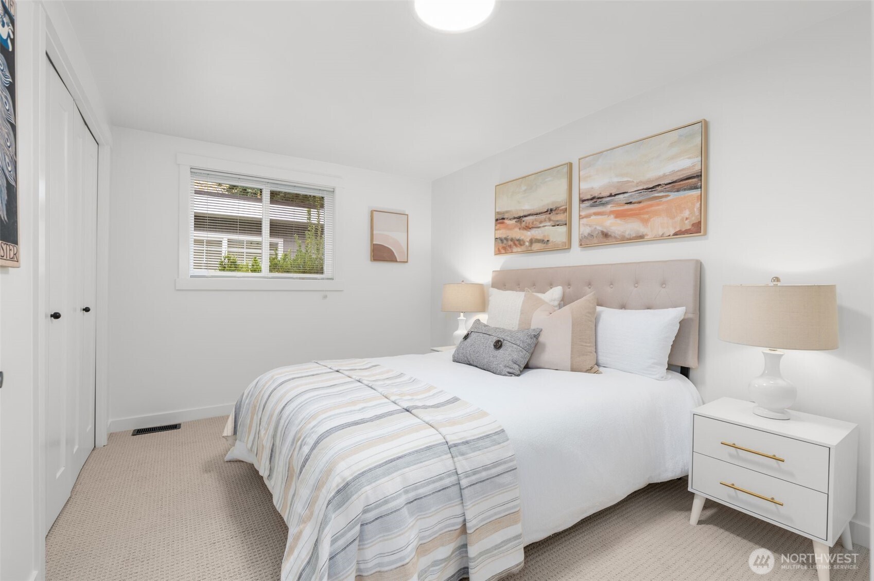 6507 41st Avenue Southwest Seattle, WA 98136 - Photo 17 of 37 a bedroom with a bed and a window