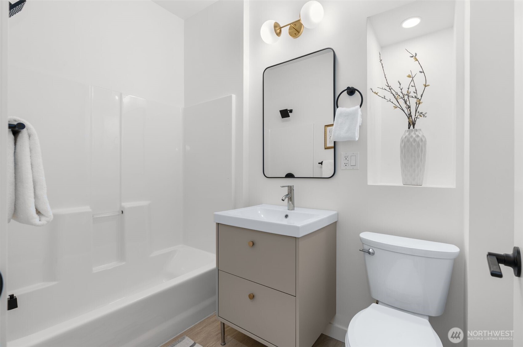 6507 41st Avenue Southwest Seattle, WA 98136 - Photo 18 of 37 a bathroom with a toilet sink and mirror