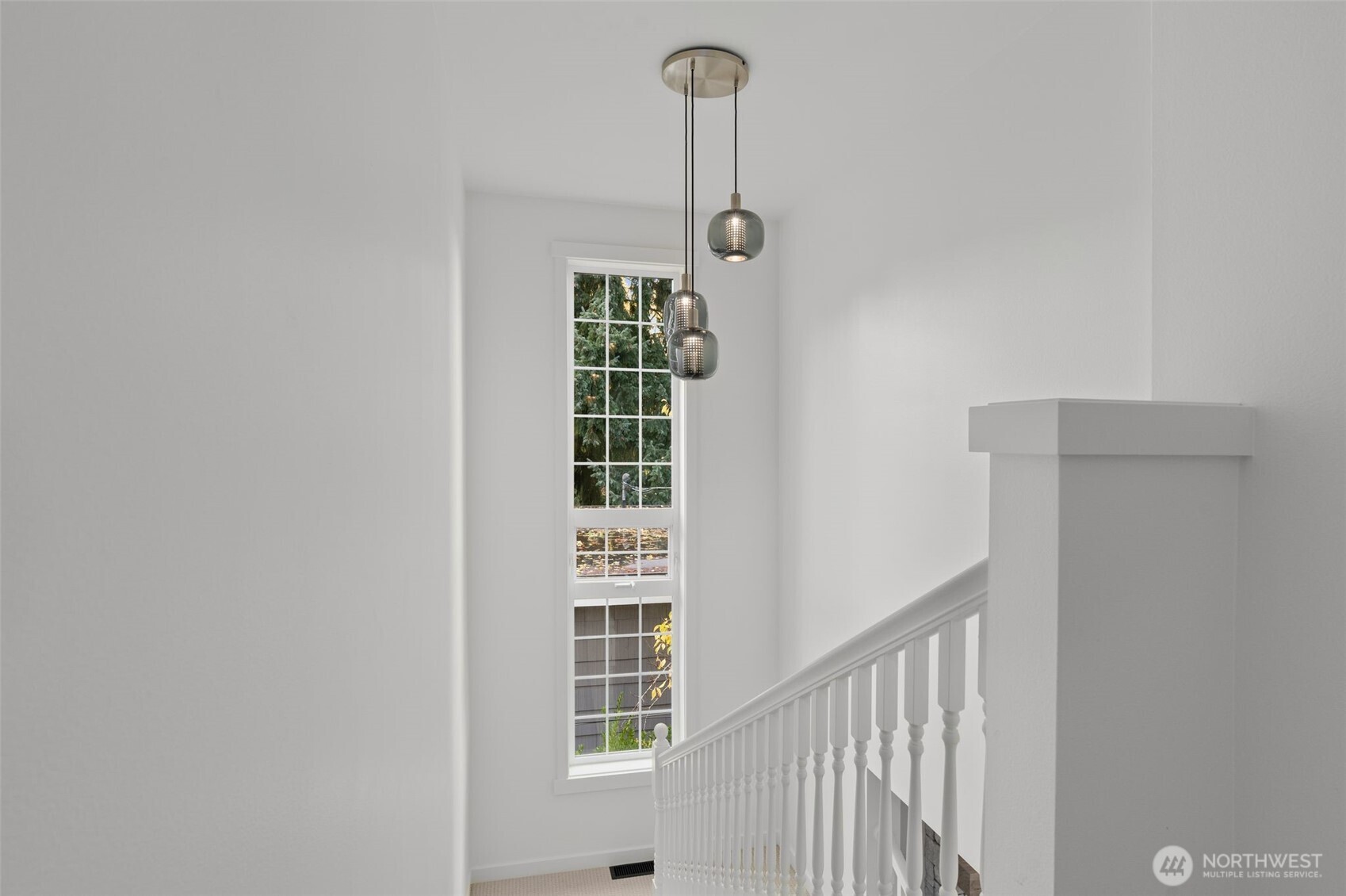 6507 41st Avenue Southwest Seattle, WA 98136 - Photo 21 of 37 a view of a hallway with windows