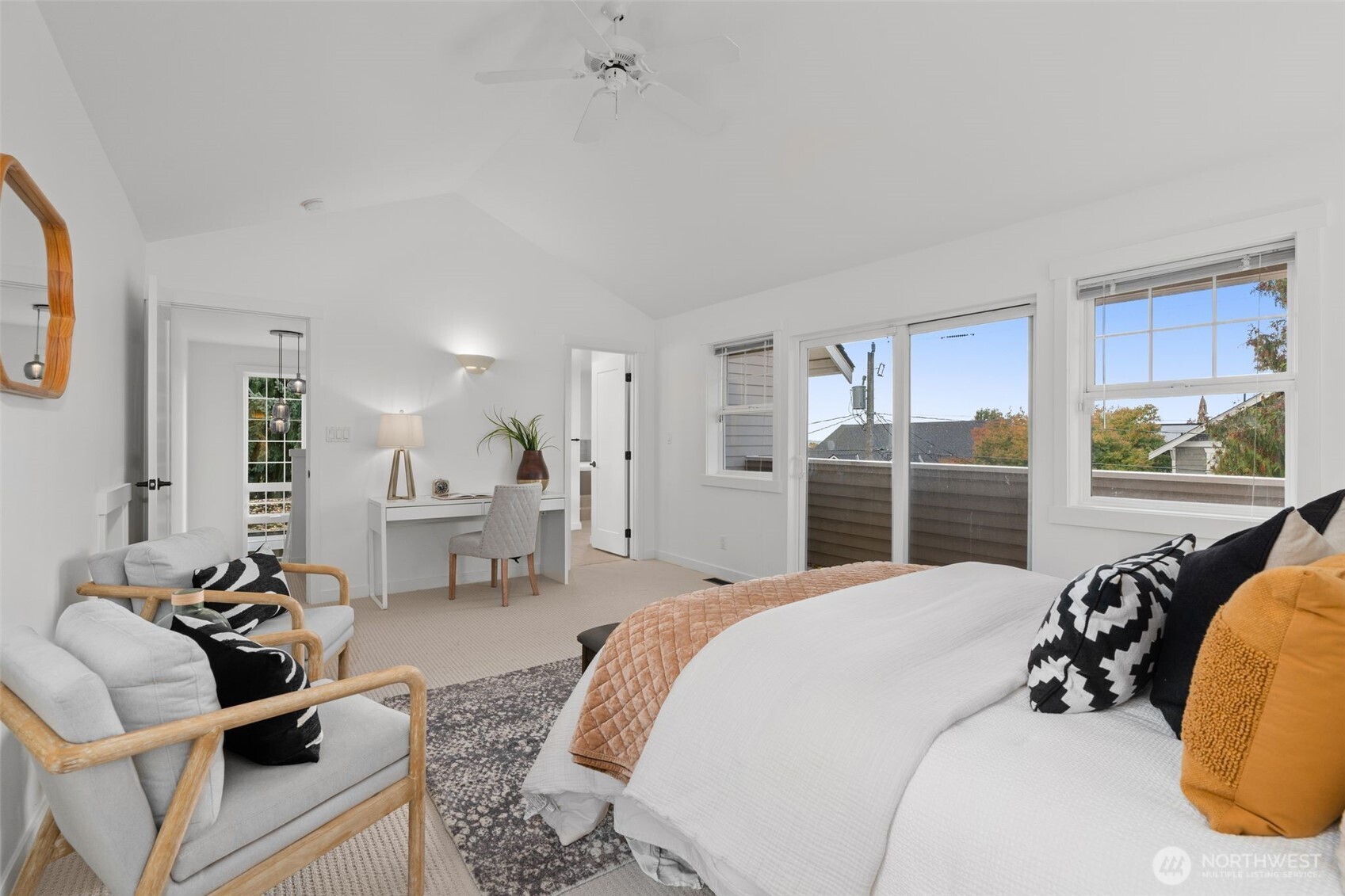 6507 41st Avenue Southwest Seattle, WA 98136 - Photo 23 of 37 a large bedroom with a bed and a view of kitchen