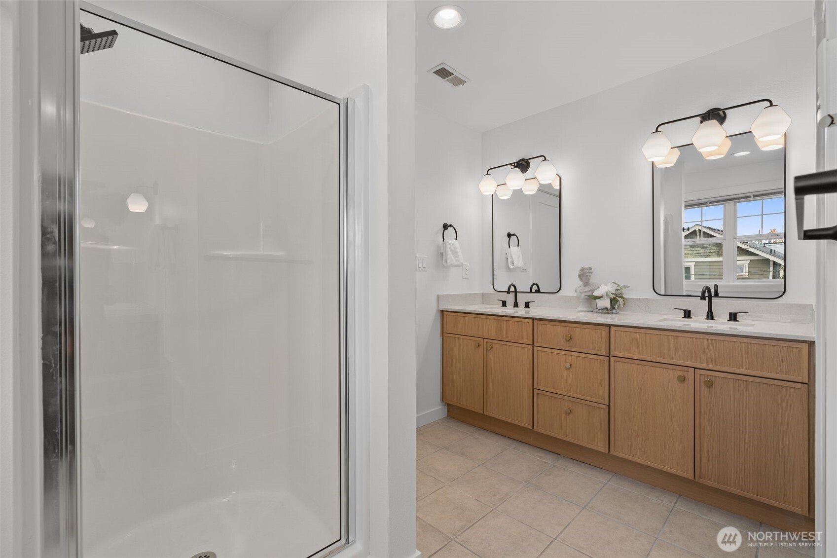 6507 41st Avenue Southwest Seattle, WA 98136 - Photo 24 of 37 a spacious bathroom with a double vanity sink mirror and shower