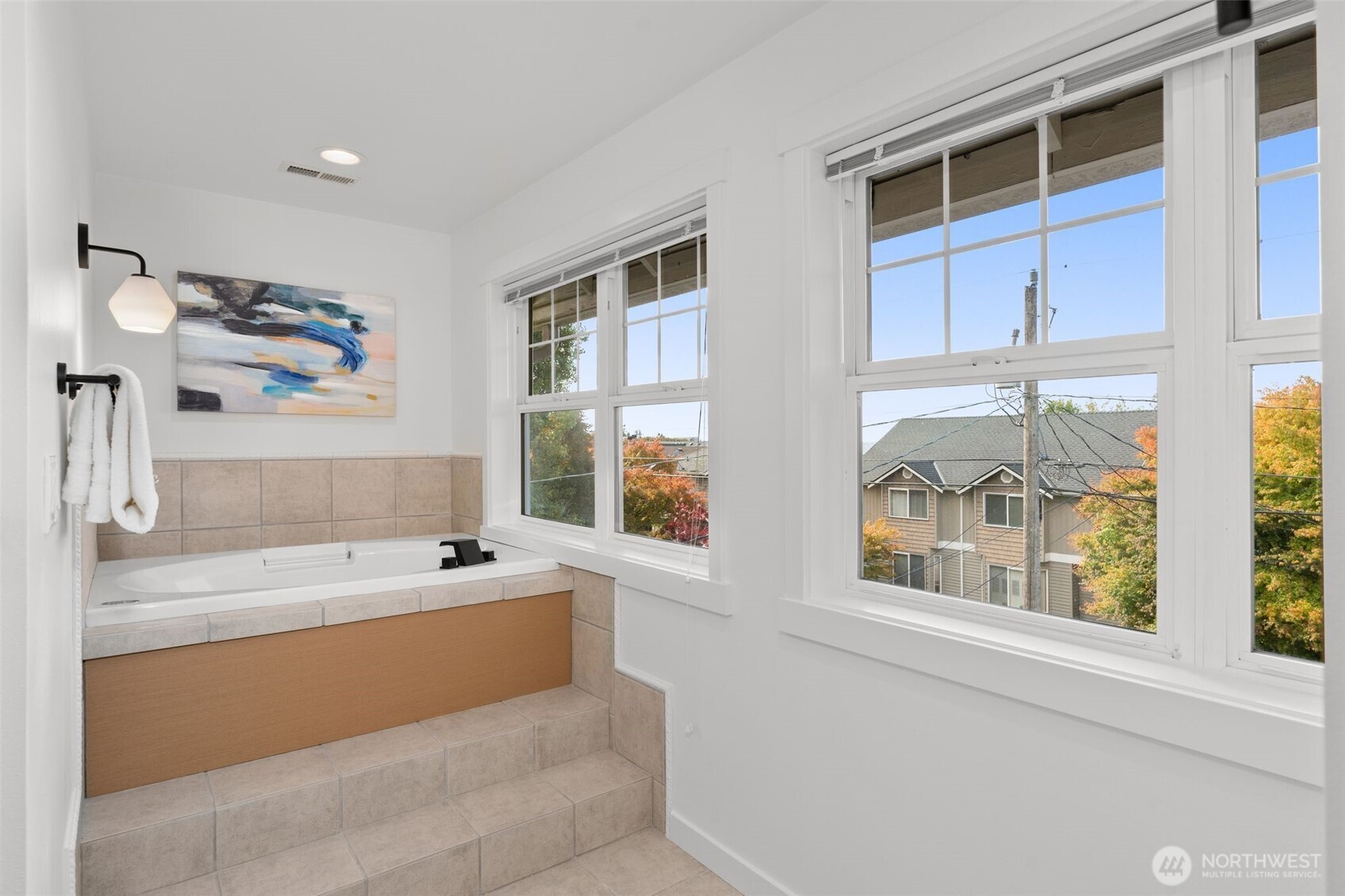 6507 41st Avenue Southwest Seattle, WA 98136 - Photo 25 of 37 a view of a bathroom with a tub and a window