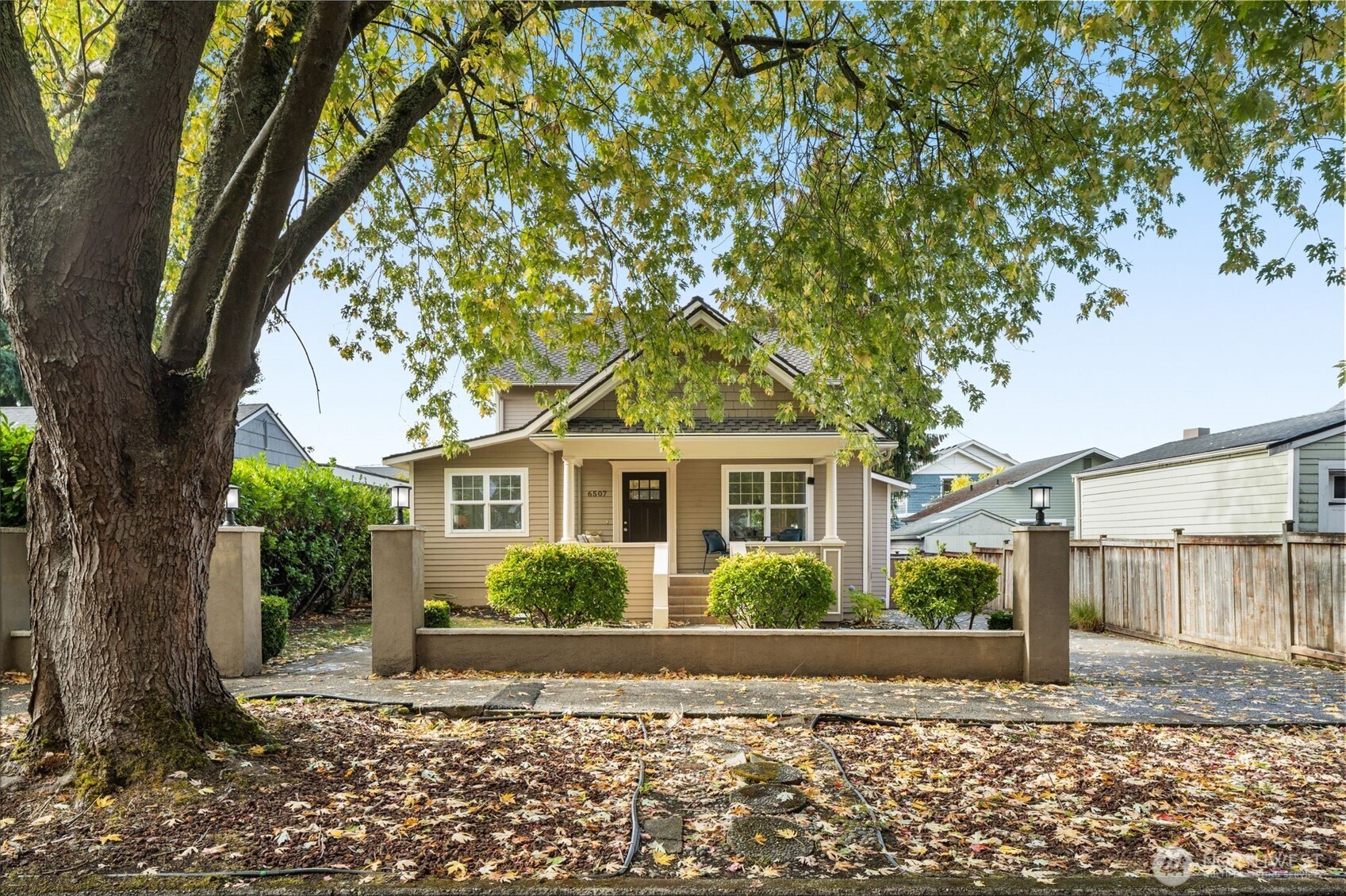 6507 41st Avenue Southwest Seattle, WA 98136 - Photo 32 of 37 a front view of a house with a garden
