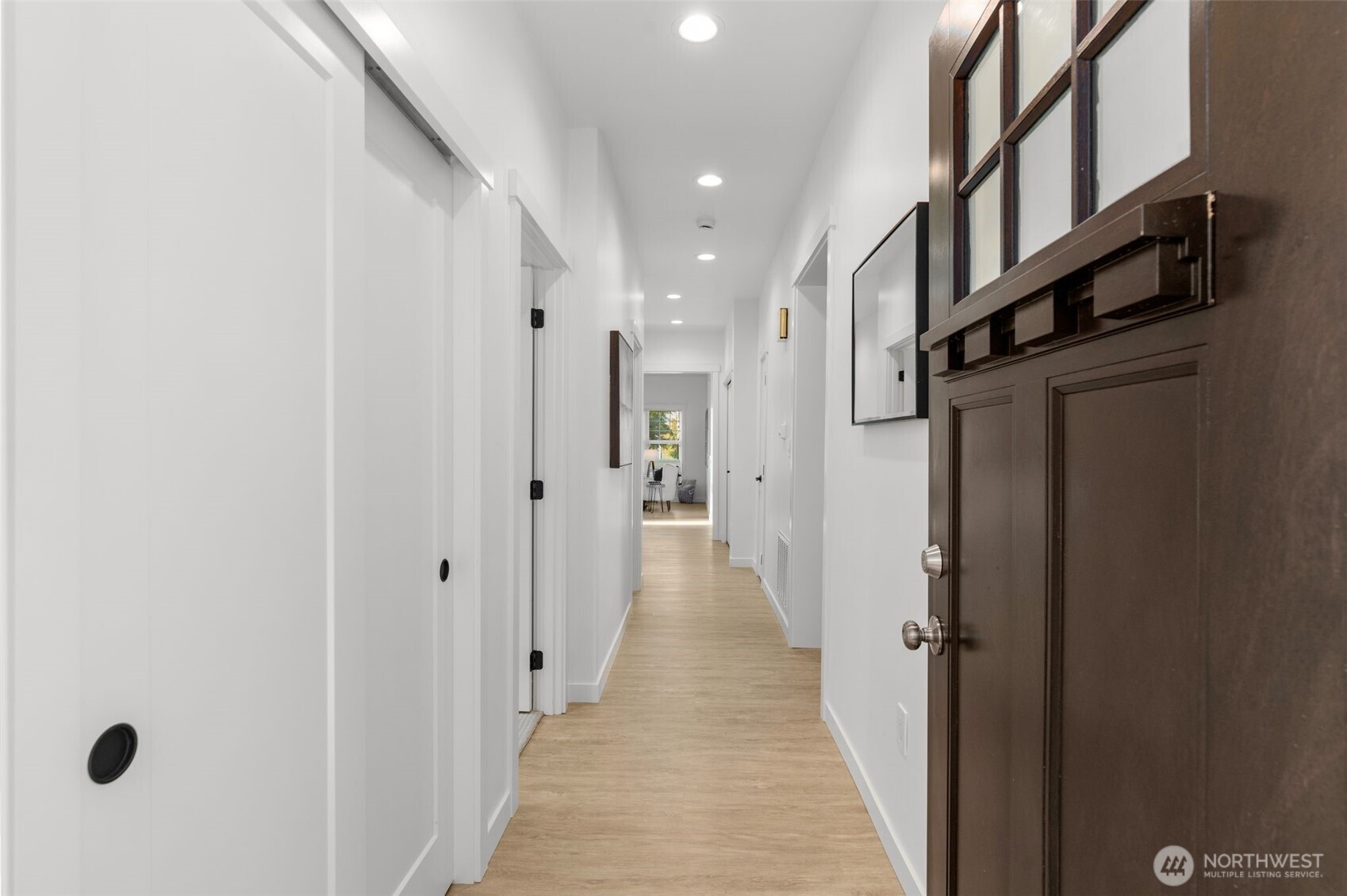 6507 41st Avenue Southwest Seattle, WA 98136 - Photo 4 of 37 a view of a hallway with a white door