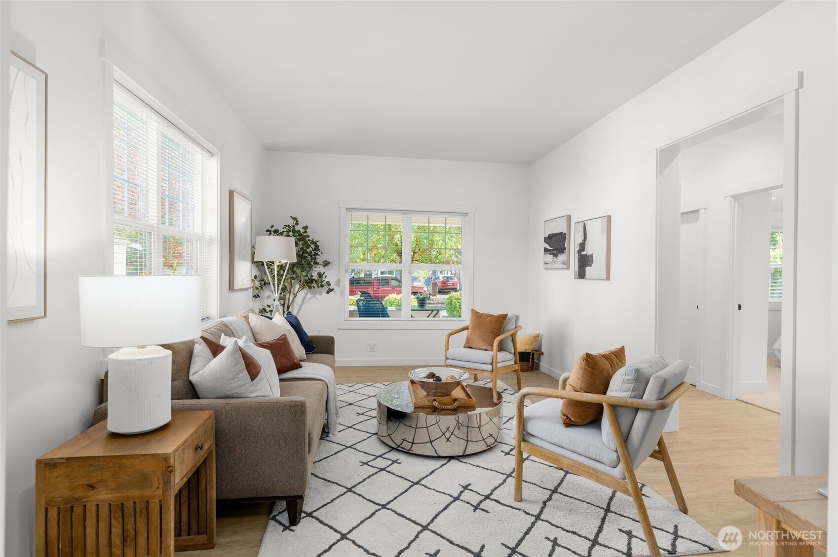 6507 41st Avenue Southwest Seattle, WA 98136 - Photo 6 of 37 a living room with furniture potted plant and a window
