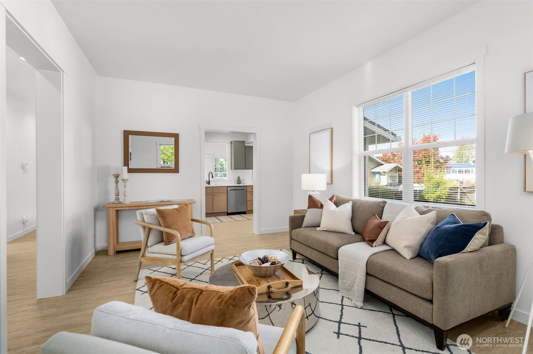 6507 41st Avenue Southwest Seattle, WA 98136 - Photo 7 of 37 a living room with furniture and a large window