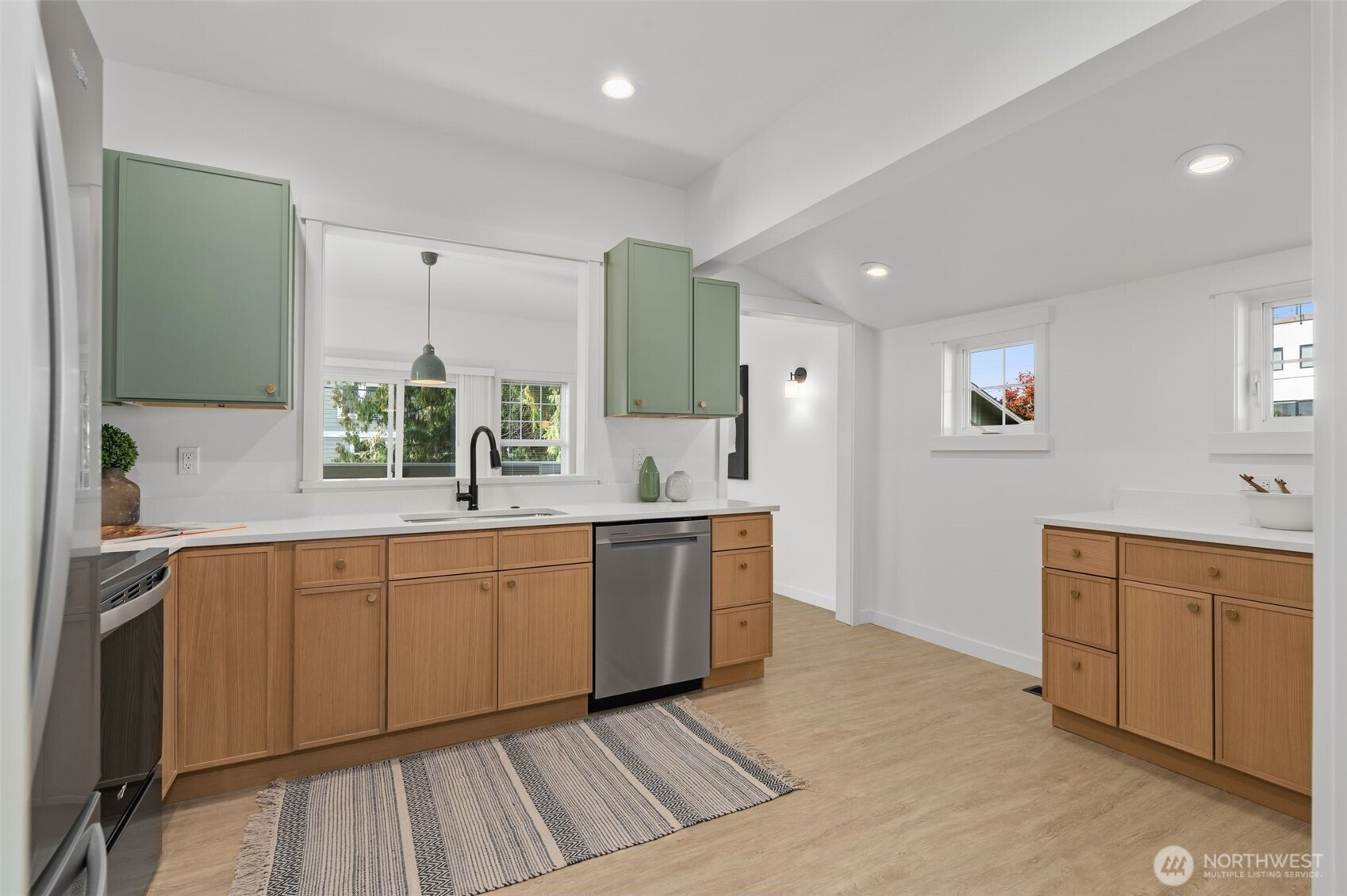 6507 41st Avenue Southwest Seattle, WA 98136 - Photo 8 of 37 a large bathroom with a sink mirror and a bathtub