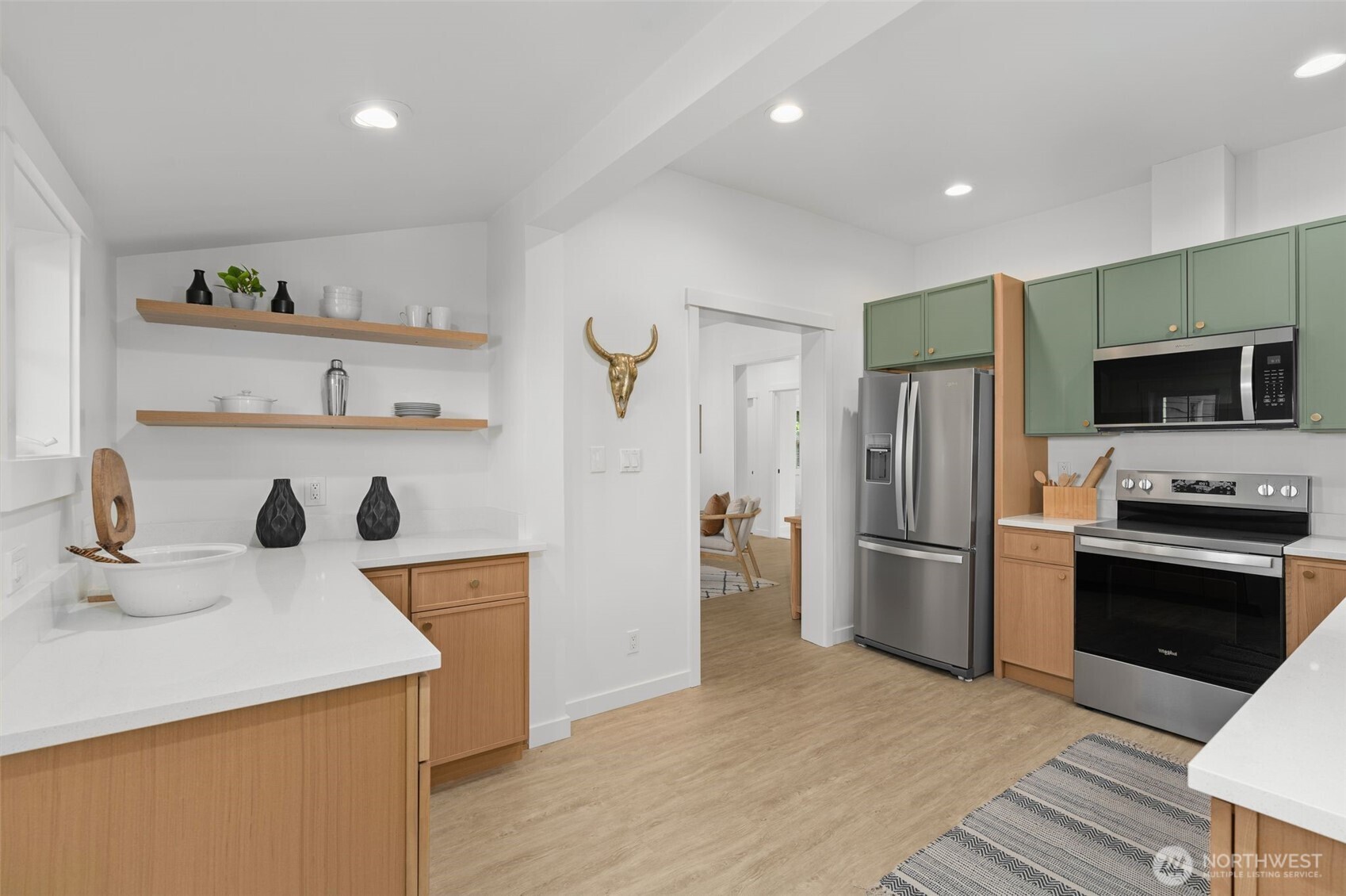 6507 41st Avenue Southwest Seattle, WA 98136 - Photo 9 of 37 a kitchen with stainless steel appliances a refrigerator and a sink
