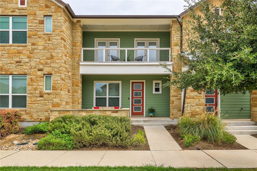 4123 Berkman Drive Austin, TX 78723 - Photo 1 of 1 front view of a brick house with a large window and potted plants