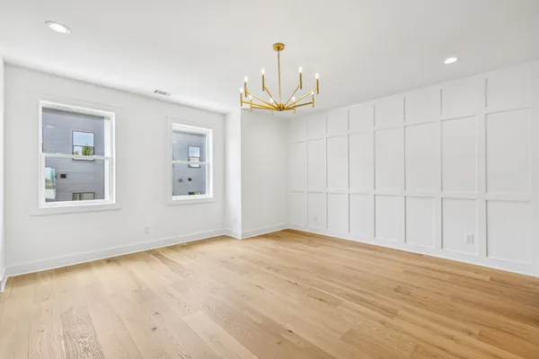 a view of an empty room with glass door