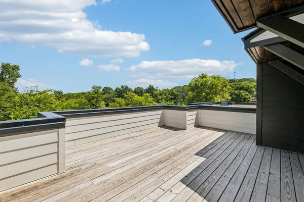 a view of balcony with wooden floor