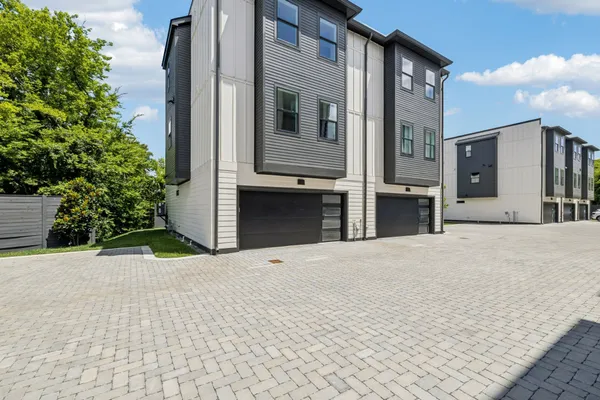 a backyard of a house with yard and garage