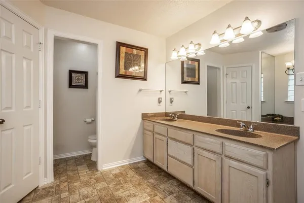 a bathroom with a tub sink and mirror