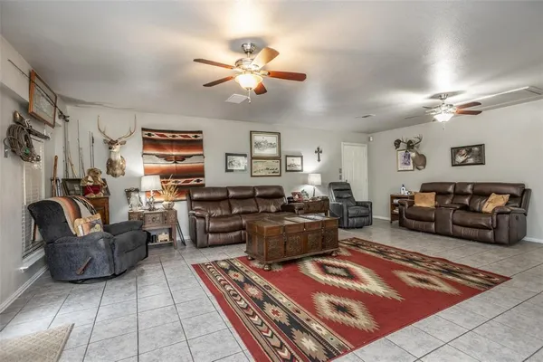 a living room with furniture and a rug