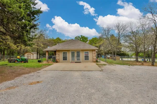 a house with trees in the background