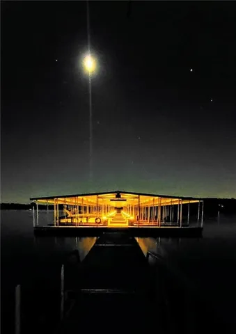 a view of swimming pool with seating space