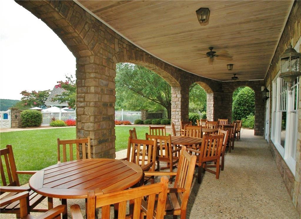 5813 Lighthouse Way Gainesville, GA 30506 - Photo 16 of 49 a view of a patio with a table chairs and a backyard