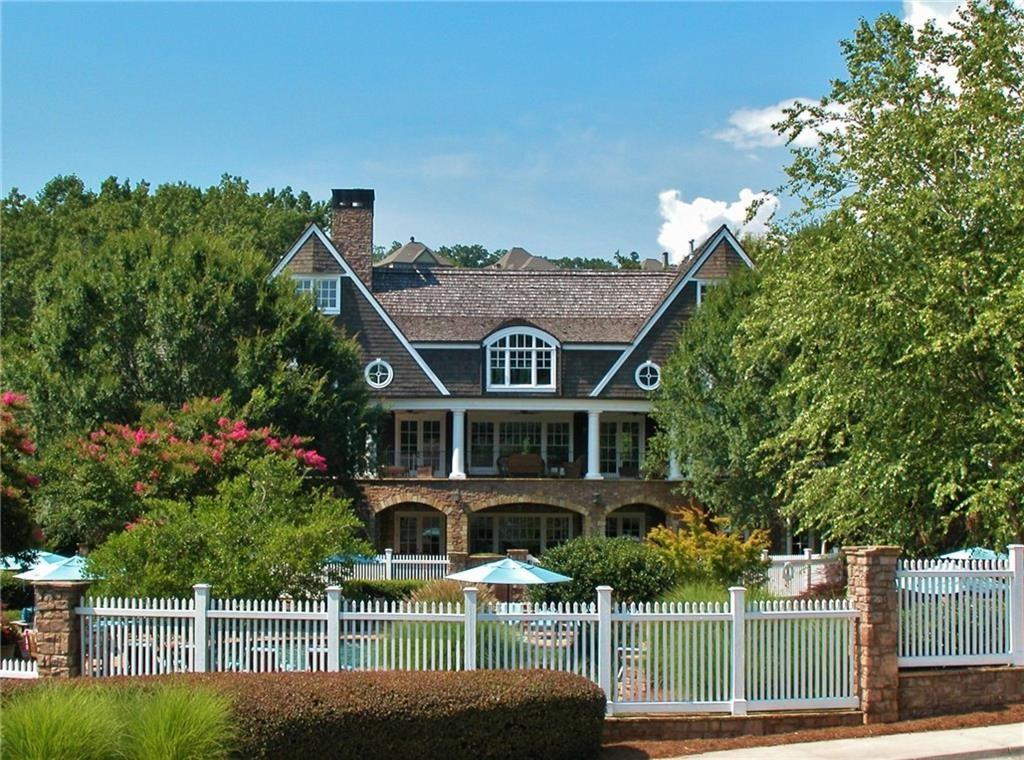 5813 Lighthouse Way Gainesville, GA 30506 - Photo 18 of 49 a front view of a house with a garden and plants