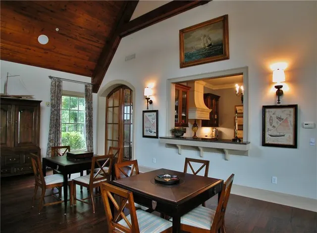 a view of a dining room with furniture and window