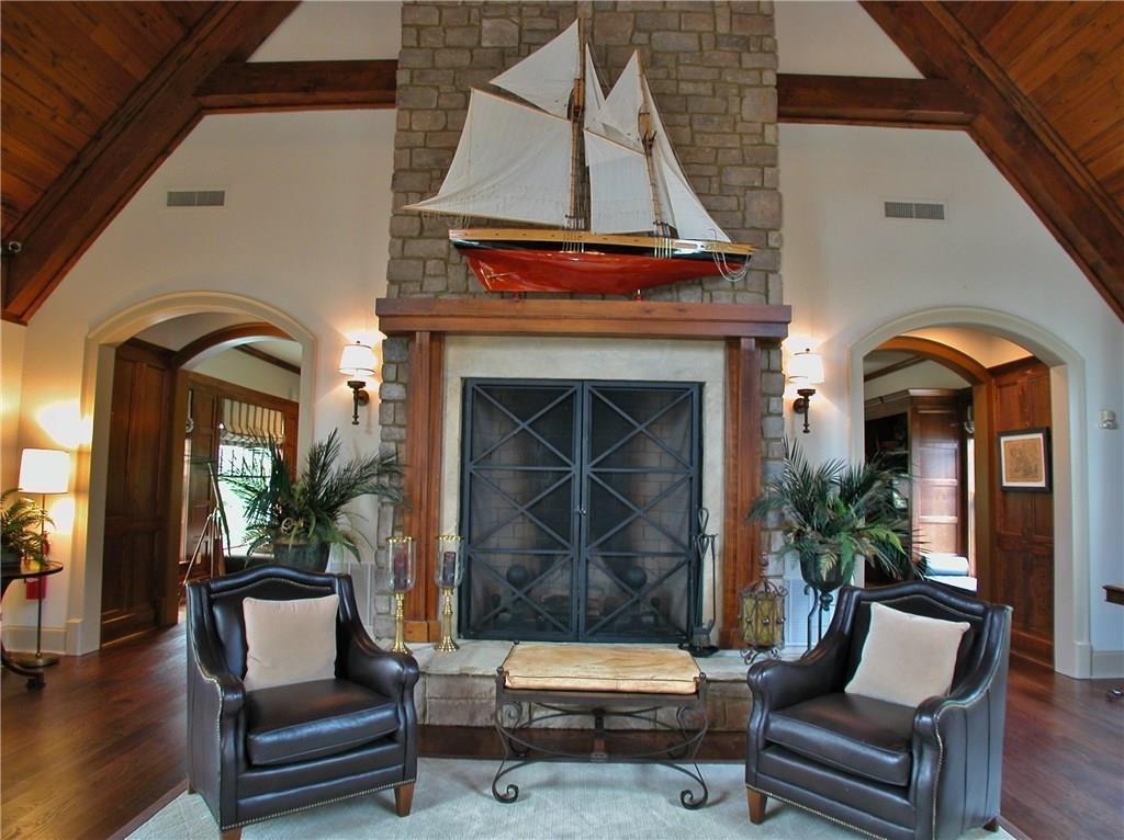 5813 Lighthouse Way Gainesville, GA 30506 - Photo 28 of 49 a living room with furniture and a fireplace