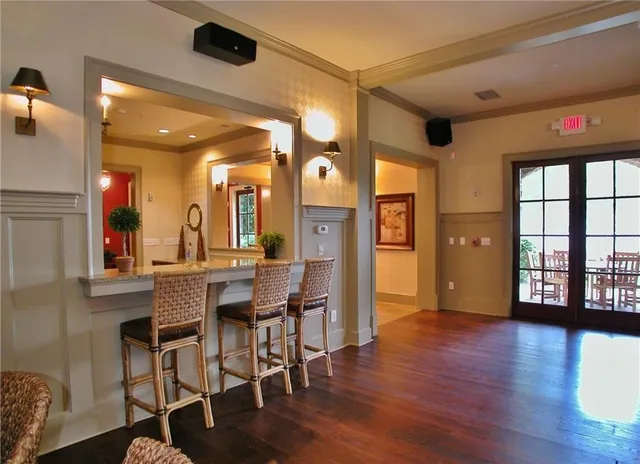 a view of a livingroom with furniture and a ceiling fan
