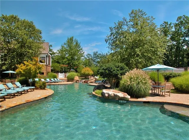 a view of a table and chairs under an umbrella