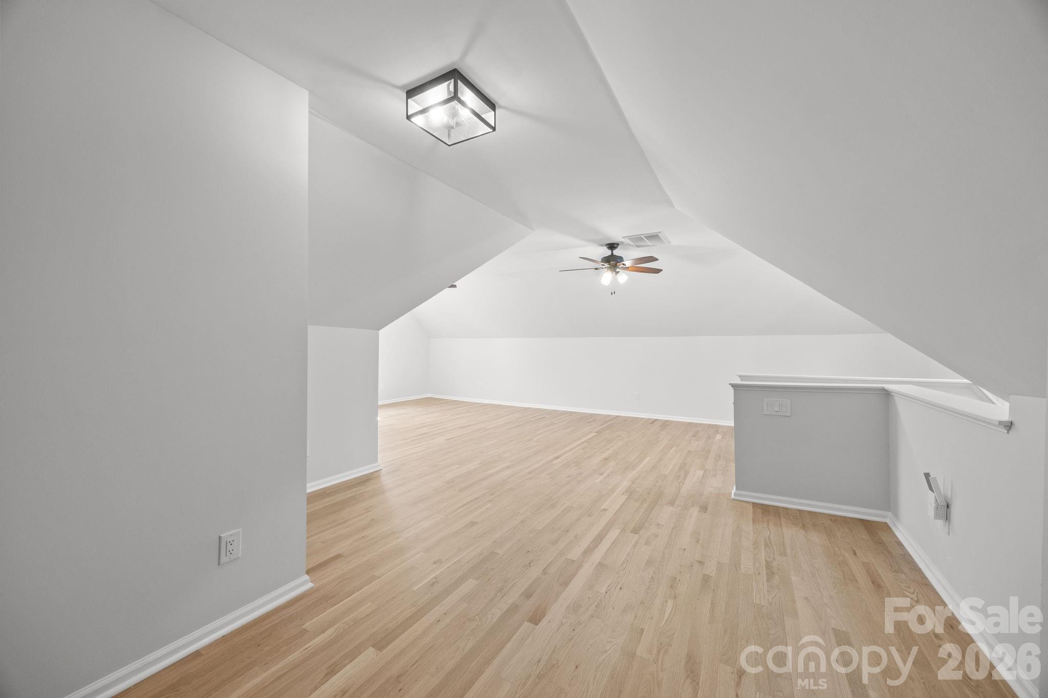 5243 Mintridge Road Mint Hill, NC 28227 - Photo 33 of 43 a view of a room with wooden floor and ceiling fan