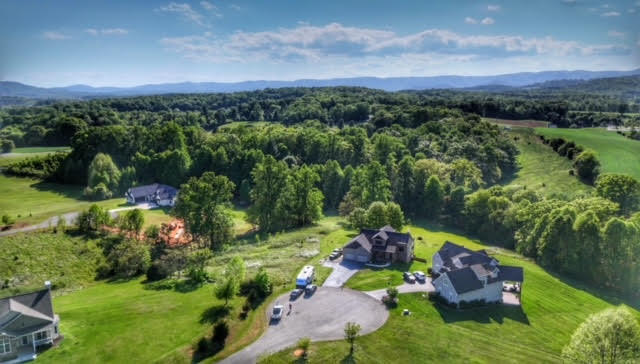 Lot 9 Cahas Summit Road Boones Mill, VA 24065 - Photo 18 of 18 a aerial view of a house with a yard and lake