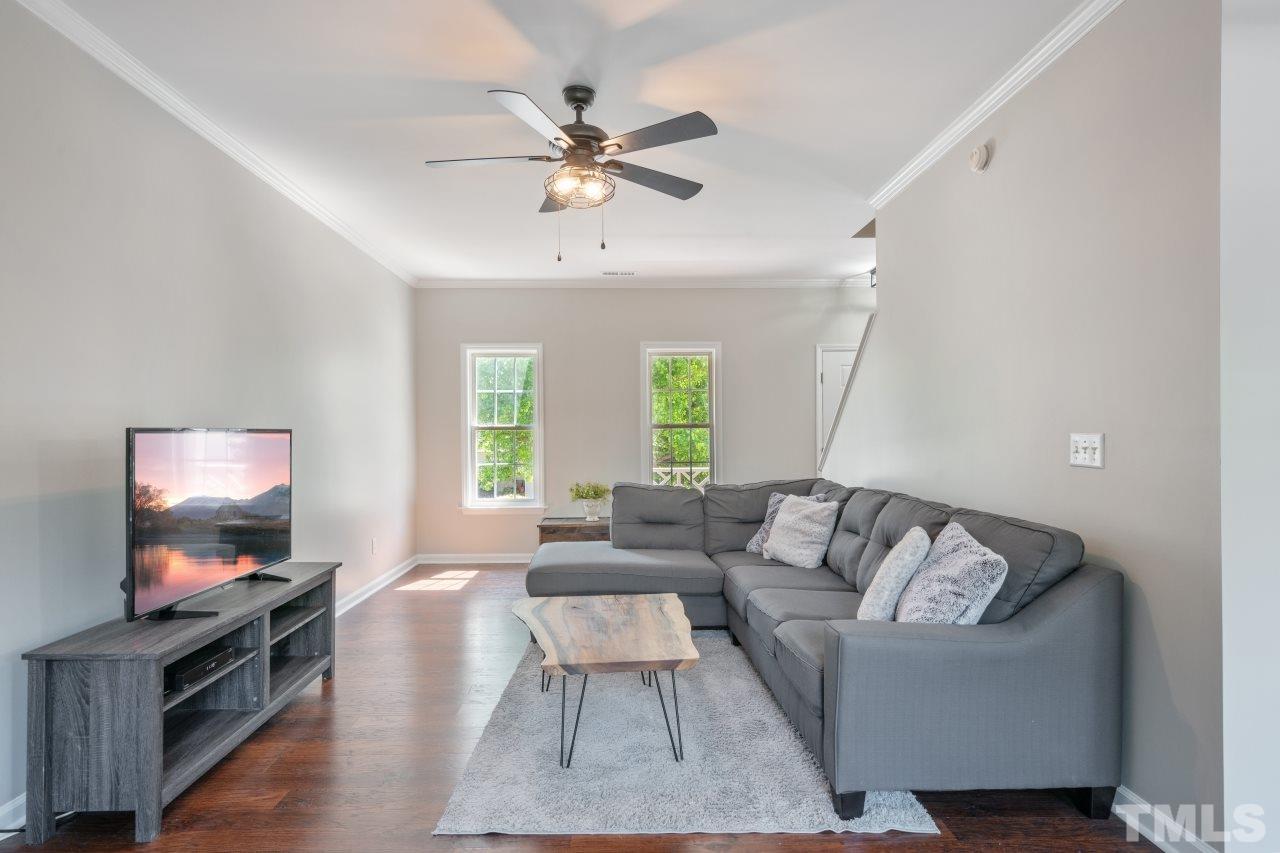 2133 Haig Point Way Raleigh, NC 27604 - Photo 12 of 28 a living room with furniture and a flat screen tv