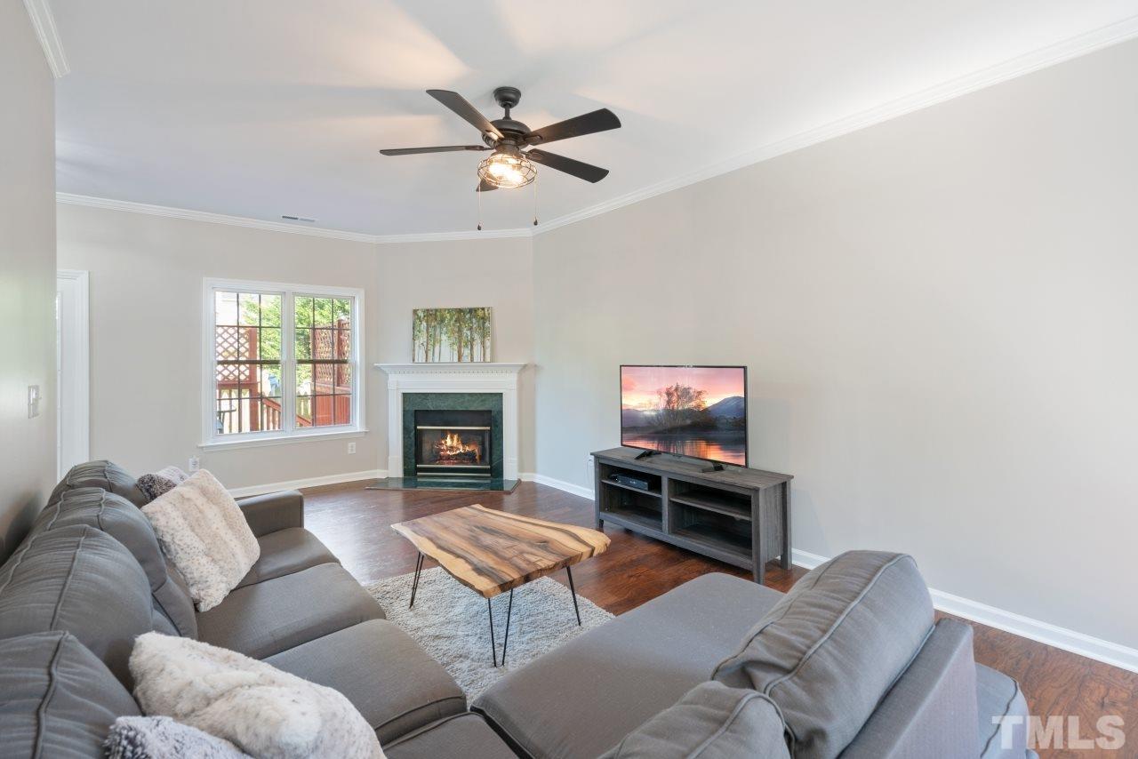 2133 Haig Point Way Raleigh, NC 27604 - Photo 13 of 28 a living room with furniture a window and a flat screen tv
