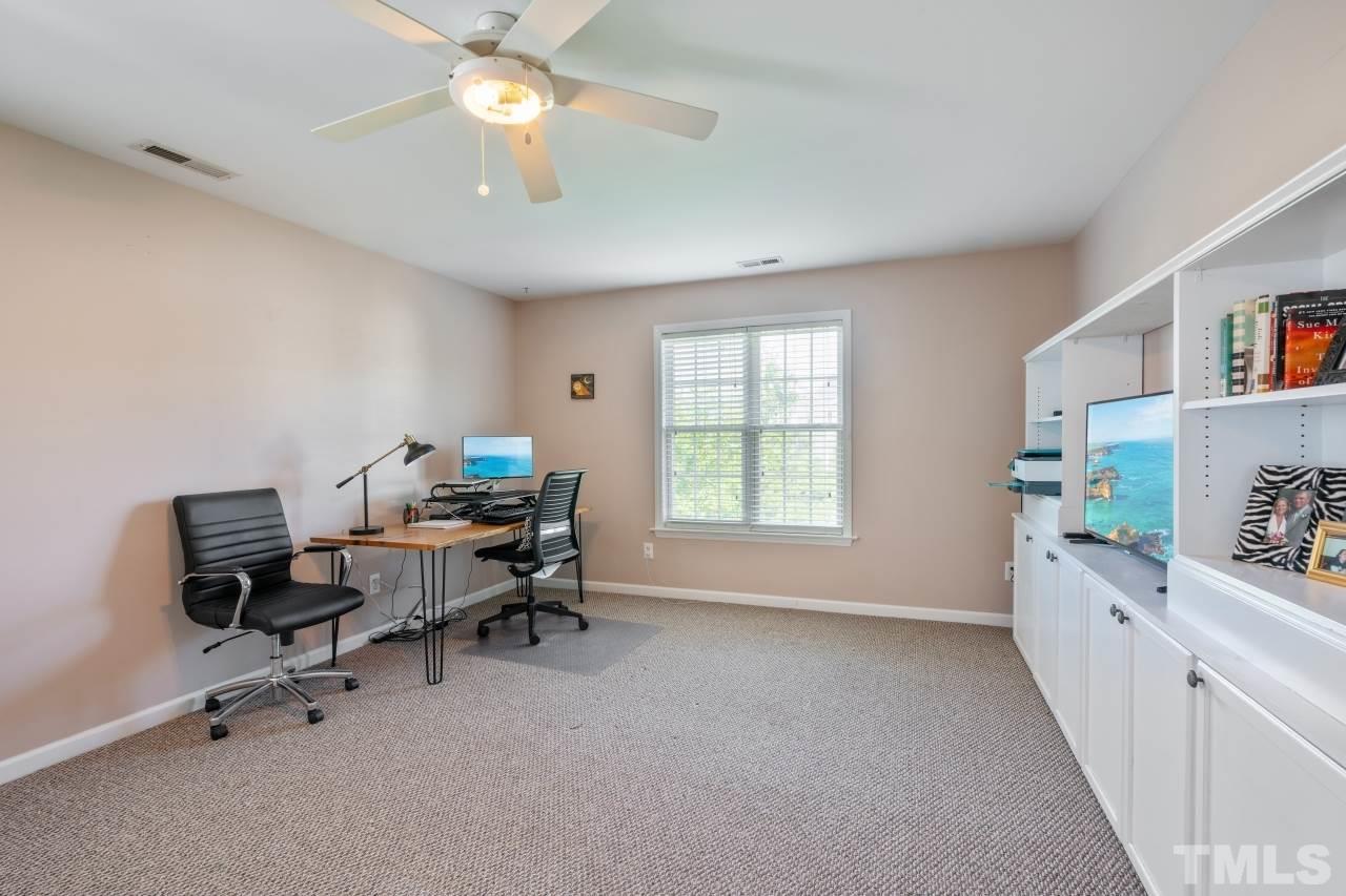 2133 Haig Point Way Raleigh, NC 27604 - Photo 20 of 28 a view of a workspace with furniture and a window