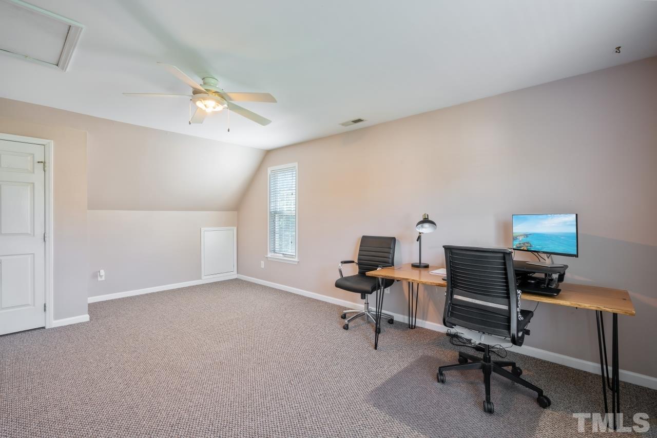 2133 Haig Point Way Raleigh, NC 27604 - Photo 21 of 28 a view of a workspace with furniture and a window