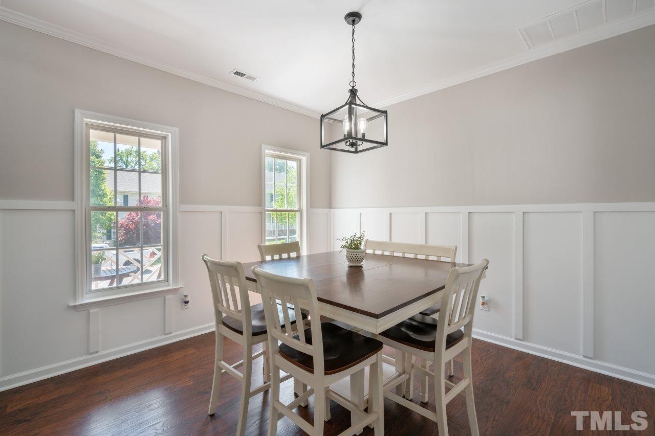 2133 Haig Point Way Raleigh, NC 27604 - Photo 5 of 28 a view of a dining room with a table and chairs