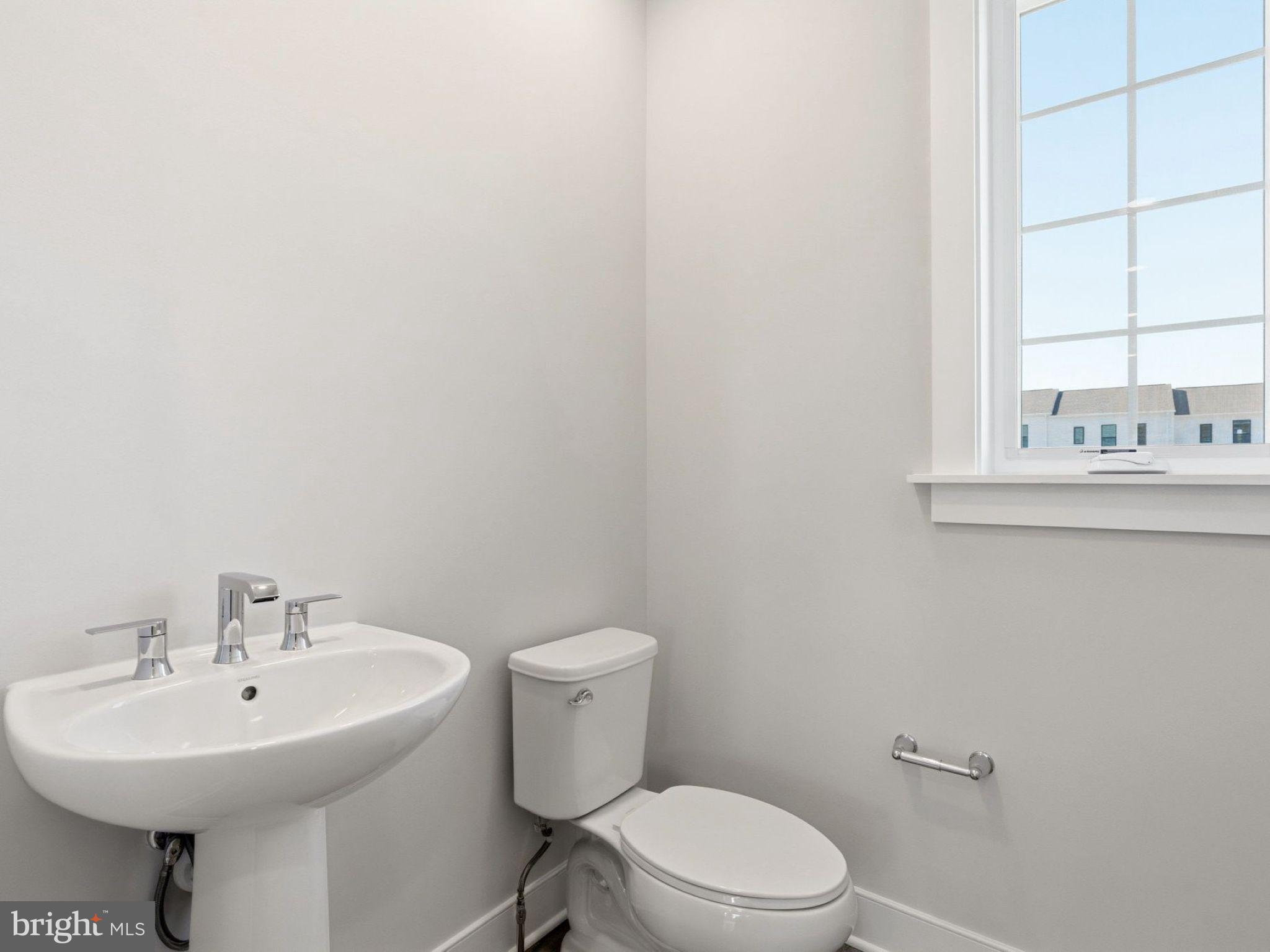 23 Snap Dragon Road Carlisle, PA 17015 - Photo 18 of 36 a bathroom with a sink a toilet and mirror