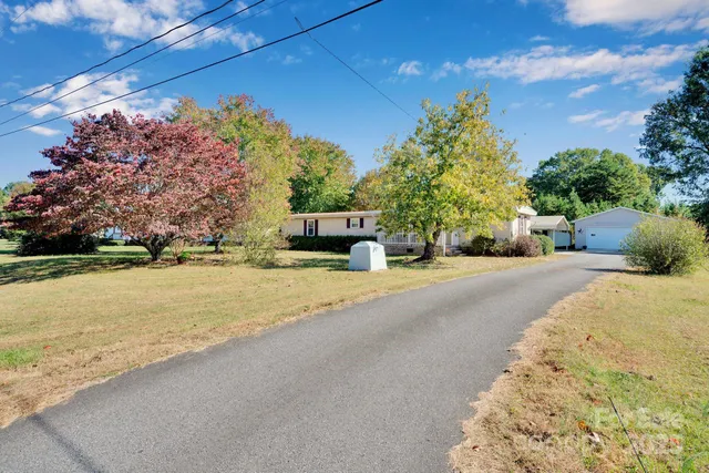 a view of a wooden deck with a yard