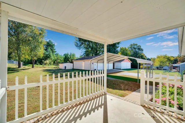 a view of a patio with a yard