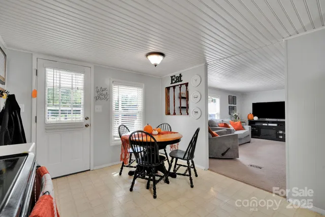 a outdoor dining space with furniture and chandelier