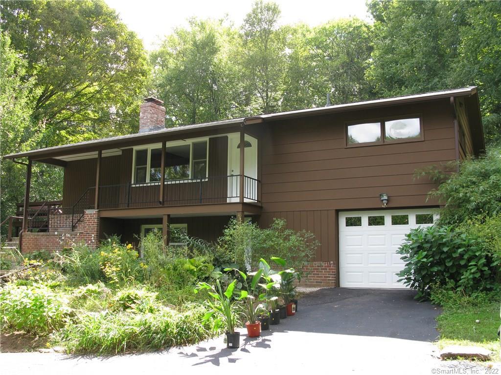 433 Saybrook Road Haddam, CT 06441 - Photo 1 of 1 a side view of a house with a yard