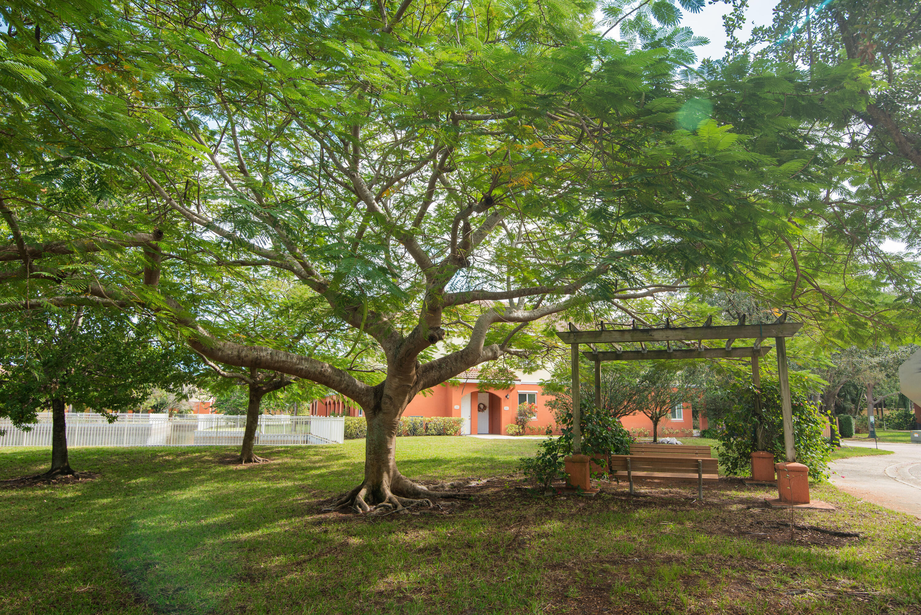 53 Southeast Sedona Circle, Unit 106 Stuart, FL 34994 - Photo 18 of 19 a view of a park with large trees