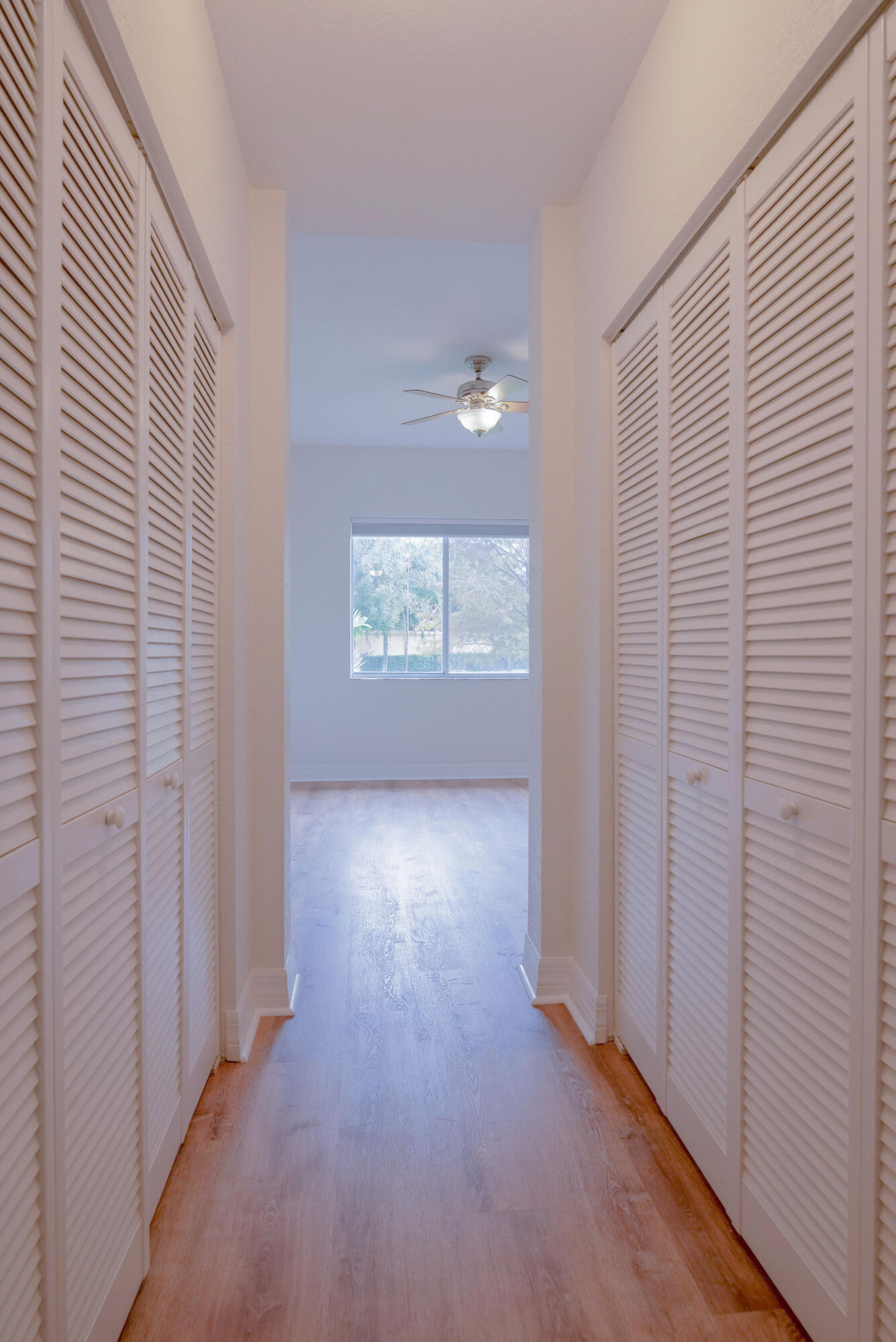53 Southeast Sedona Circle, Unit 106 Stuart, FL 34994 - Photo 8 of 19 an empty room with windows