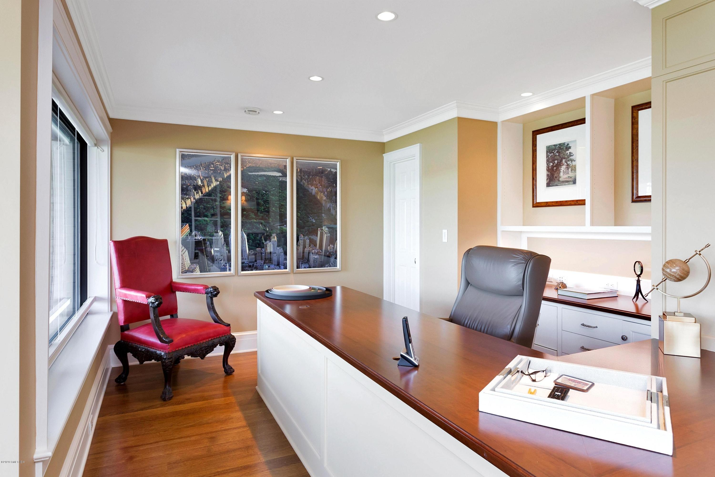 680 Steamboat Road, Unit 5 Greenwich, CT 06830 - Photo 17 of 21 a living room with furniture and floor to ceiling windows