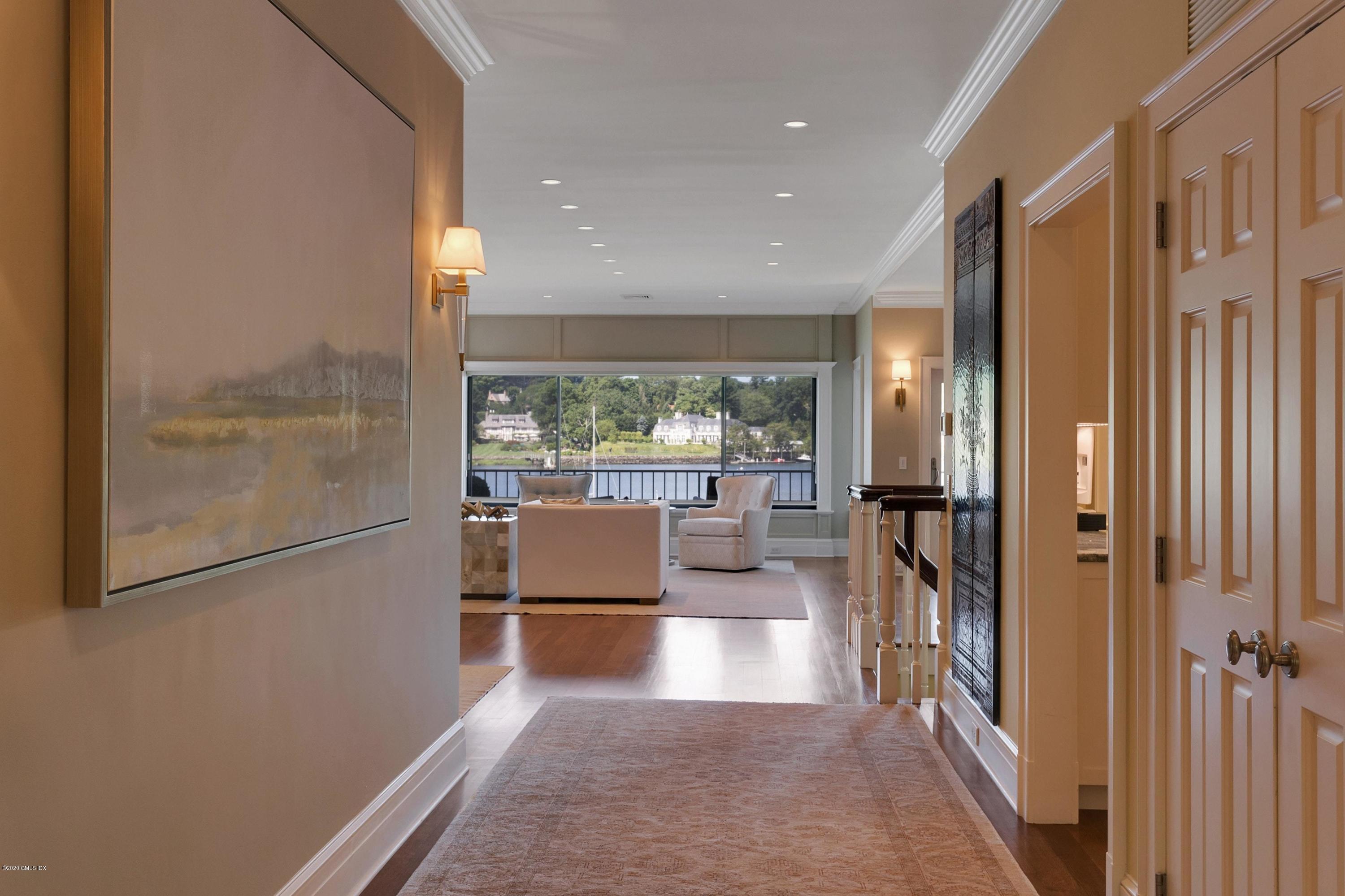 680 Steamboat Road, Unit 5 Greenwich, CT 06830 - Photo 3 of 21 a view of a hallway with the view of living room and window