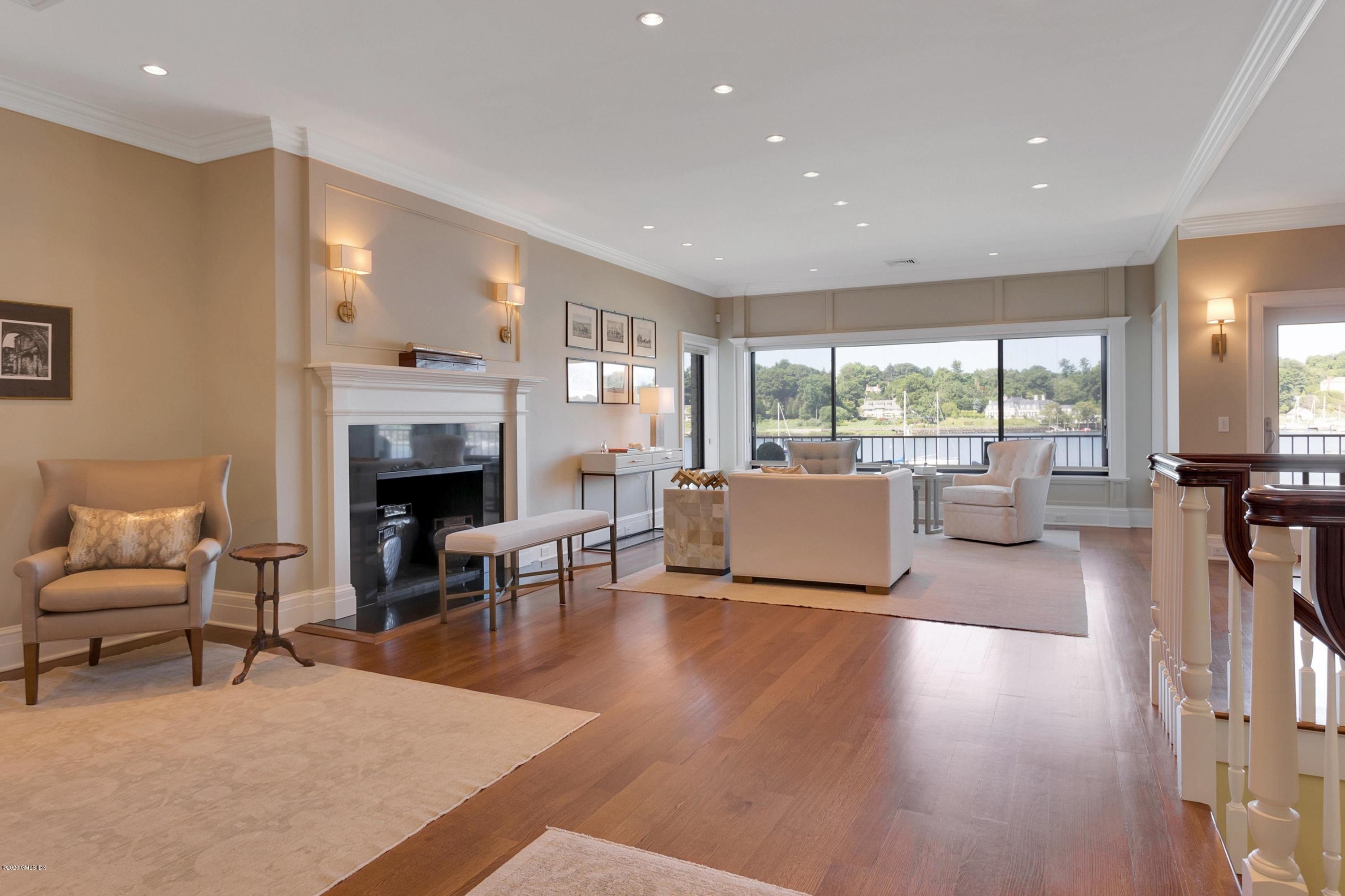 680 Steamboat Road, Unit 5 Greenwich, CT 06830 - Photo 4 of 21 a living room with furniture fireplace and a table
