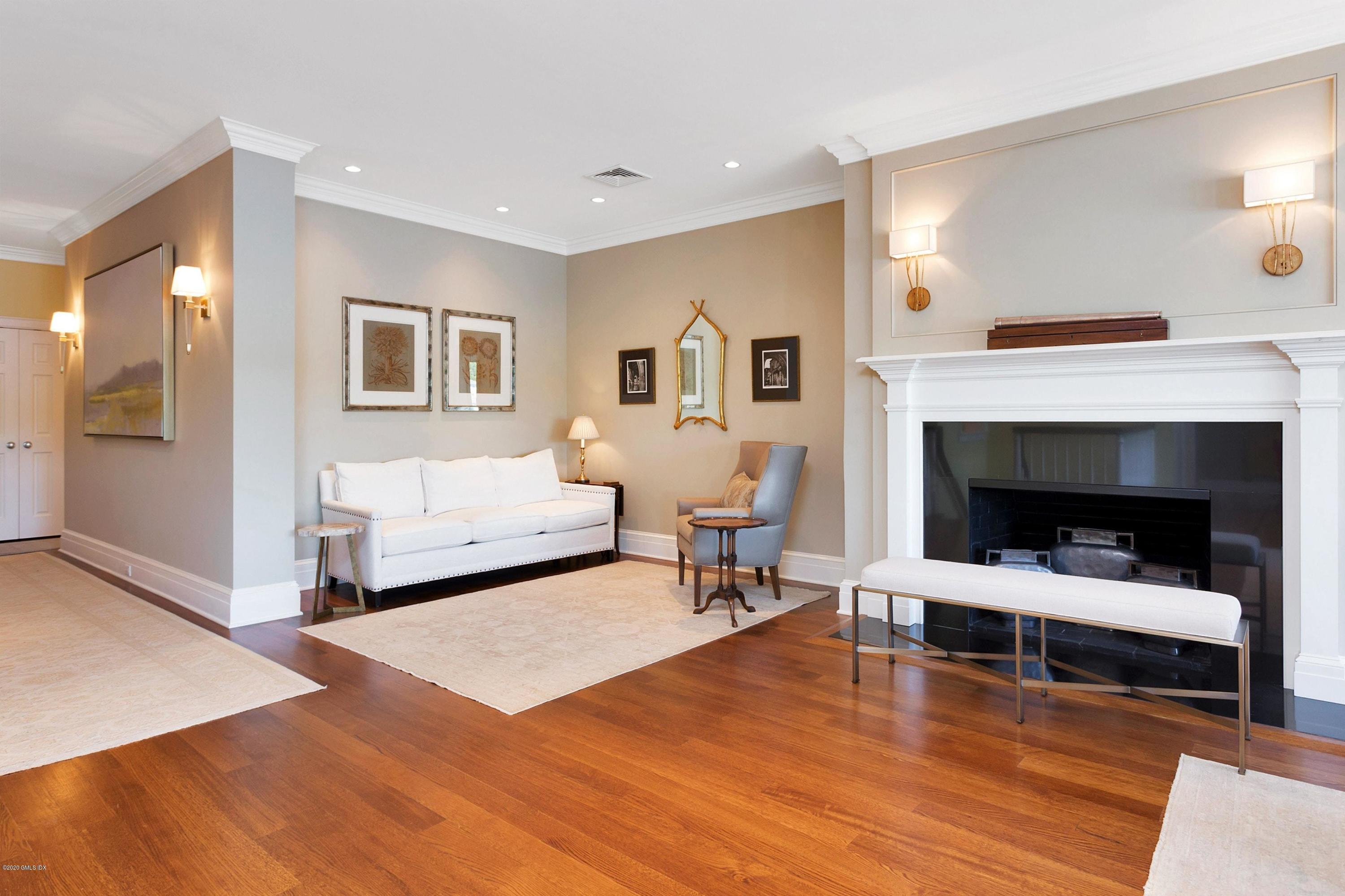 680 Steamboat Road, Unit 5 Greenwich, CT 06830 - Photo 5 of 21 a living room with furniture and a fireplace