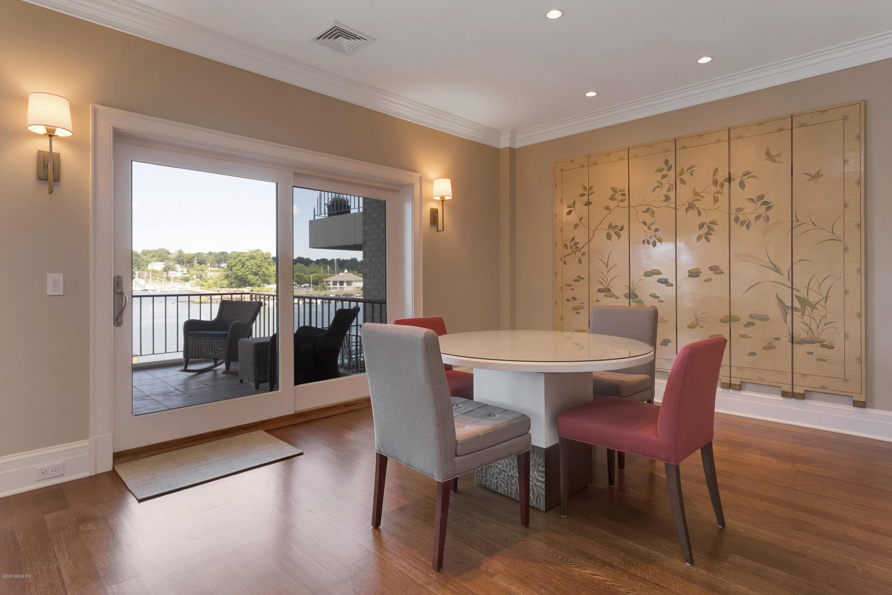 680 Steamboat Road, Unit 5 Greenwich, CT 06830 - Photo 8 of 21 a view of a dining room with furniture window and wooden floor