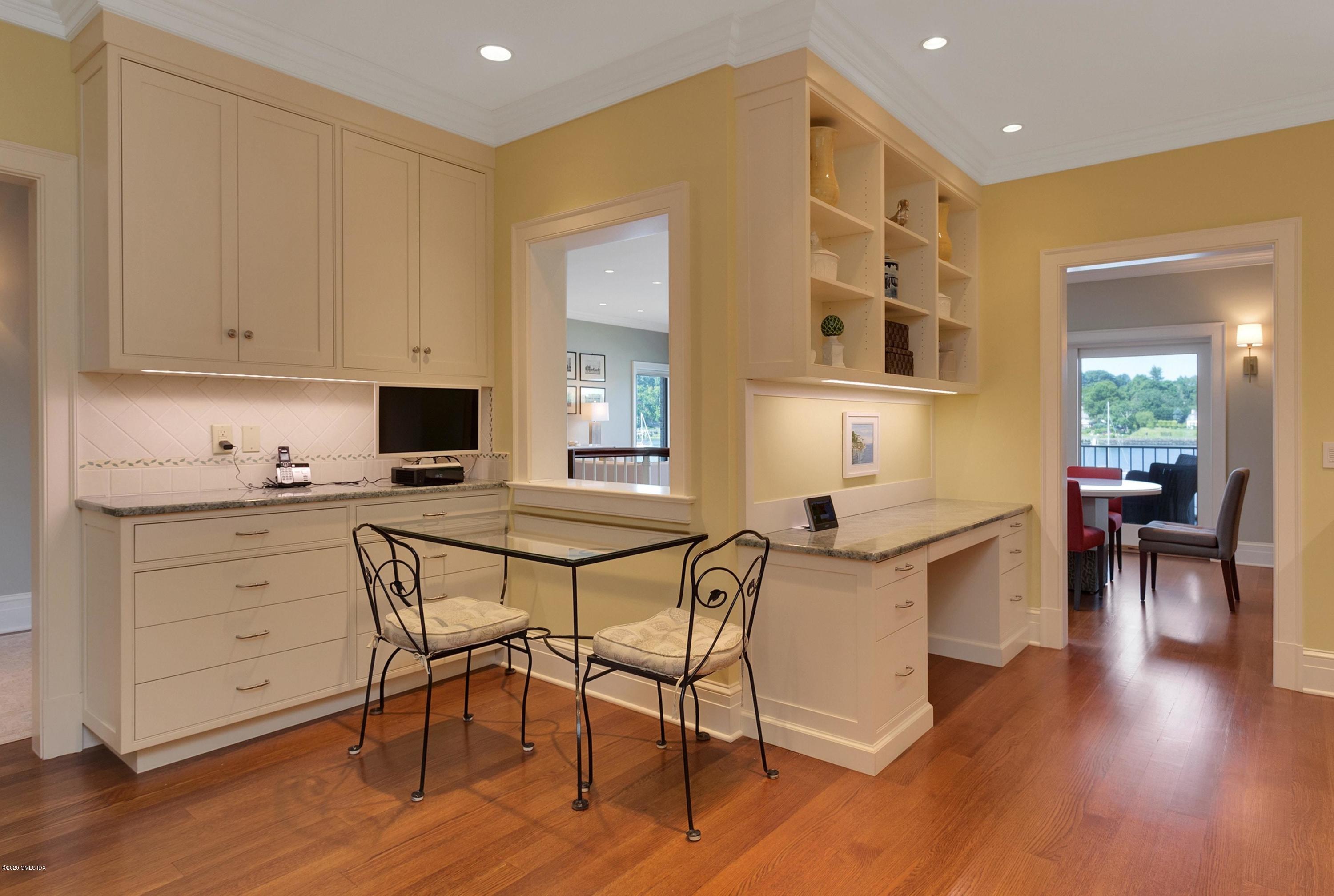 680 Steamboat Road, Unit 5 Greenwich, CT 06830 - Photo 10 of 21 a view of a dining room with furniture and wooden floor