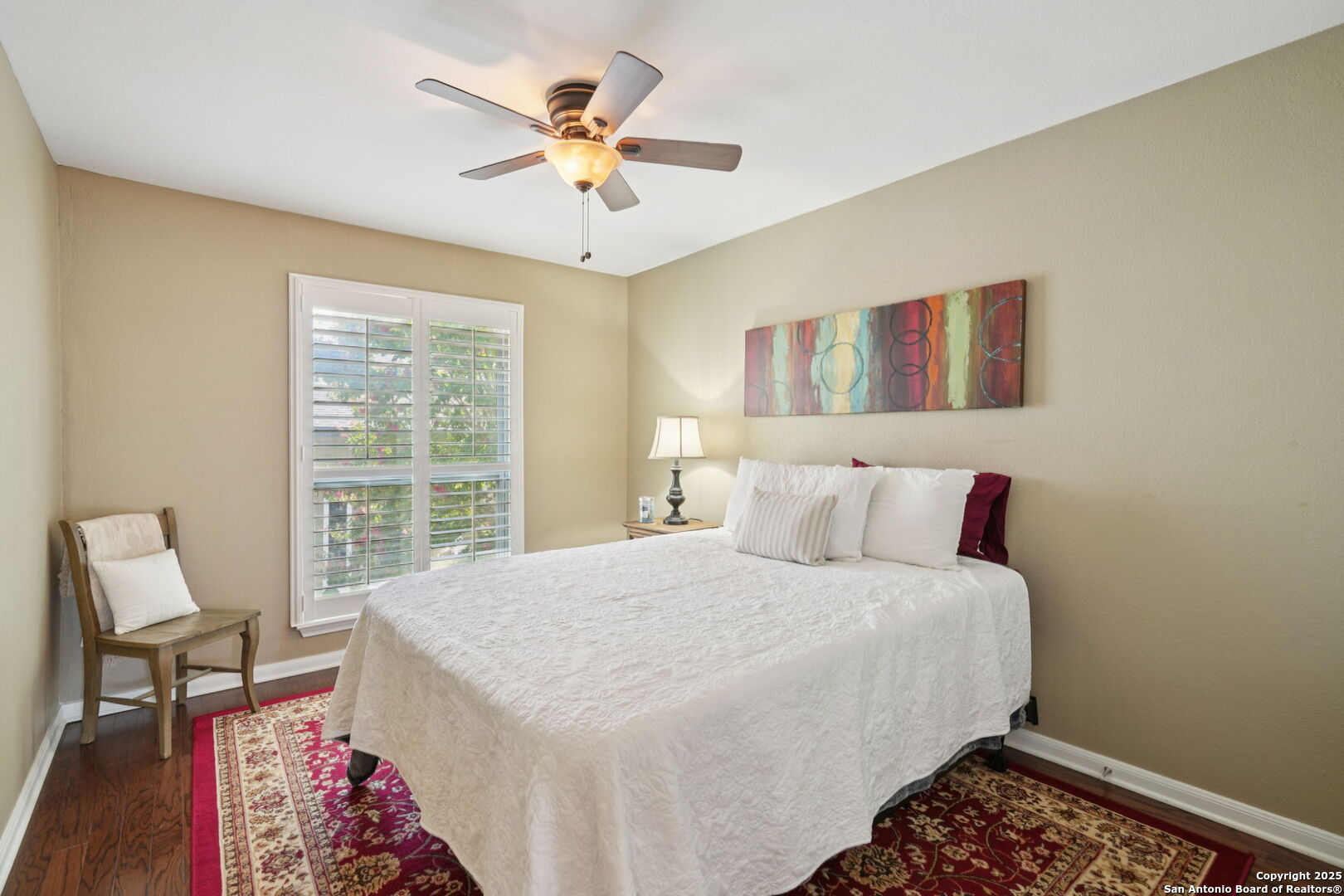 100 Lorenz Road, Unit 1204 San Antonio, TX 78209 - Photo 14 of 27 a bedroom with a large bed and a chandelier